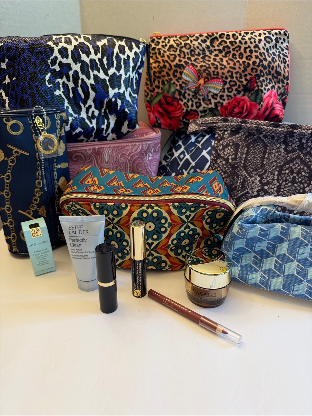 Estee Lauder lip liner with animal print and roses pouch.